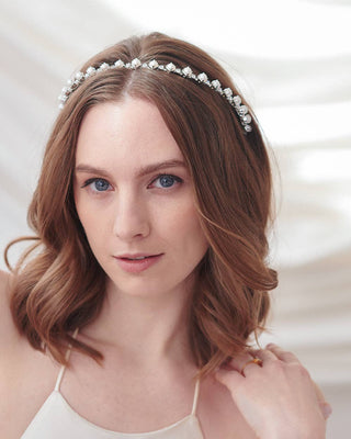 Woman wearing a decorative headband with a blurred background