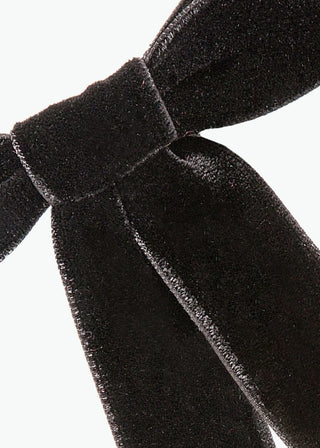 Close-up of Velvet Bow Barrette in Black on white background – smooth velvet texture and fine detail