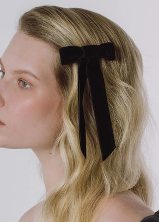 Model wearing Velvet Bow Barrette in Black – effortless and timeless accessory