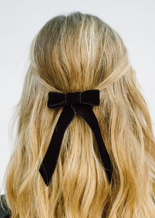 Back view of model with Velvet Bow Barrette in Black – perfect for formal or casual looks