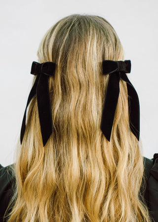 Model wearing Velvet Bow Barrette in Black – chic and sophisticated styling