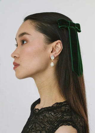 Model with Velvet Bow Barrette in Emerald – swept to the side for a sophisticated style