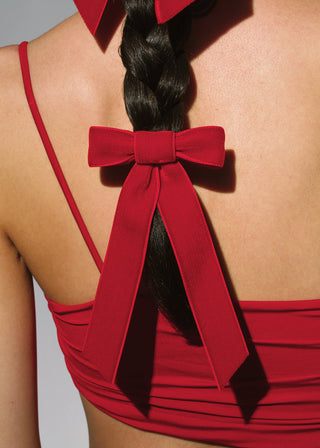 Model wearing Velvet Bow Barrette in Rouge – stylish accessory for any occasion