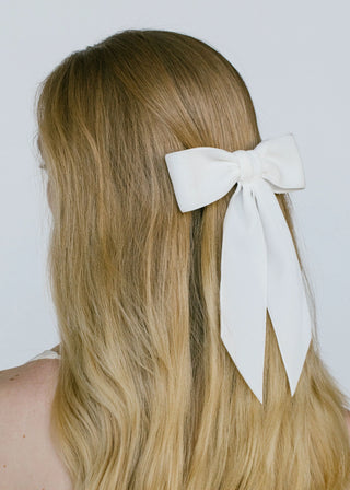 Model wearing Wide Velvet Bow Barrette – elegant oversized hair accessory for all hair types