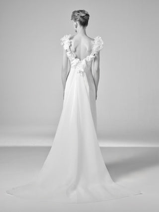 Viktor&Rolf luxury bridal gown showcasing couture craftsmanship in crepe, with sculptural florals and bespoke detailing for an exclusive made-to-order experience