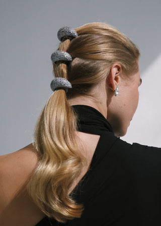 High-gloss bridal hairpiece with sculpted form, ideal for formal events and designer styling