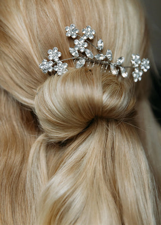 Handcrafted luxury hair comb featuring Swarovski blooms and refined feminine structure