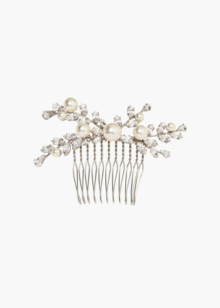 Exquisite handcrafted hair accessory with sculptural crystal vines and pearl accents, designed for couture weddings and luxury soirées.