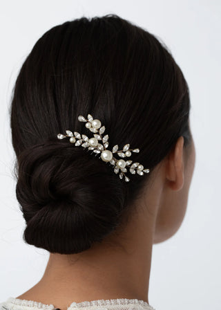 Luxury hair comb featuring faceted crystal embellishments and delicate pearl accents, handcrafted for couture bridal and evening elegance.
