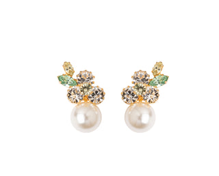 Pair of earrings with pearls and gemstones on a white background