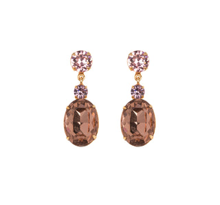 Justine earrings in antique rose featuring emerald-cut crystals on white background.