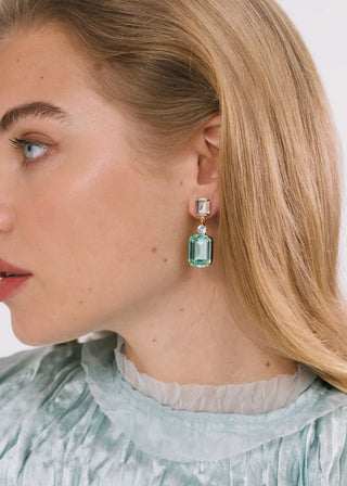 Formal designer jewelry with bold crystal geometry and polished high-fashion finish