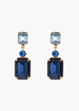 Justine Earrings on white background – emerald-cut crystals with delicate round stone accents