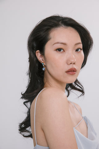 Timeless drop earrings featuring expertly mixed crystals, capturing light and adding elegance to evening looks