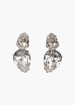 Nadine Earrings on white background – pear-shaped crystal studs with rhodium-plated brass setting