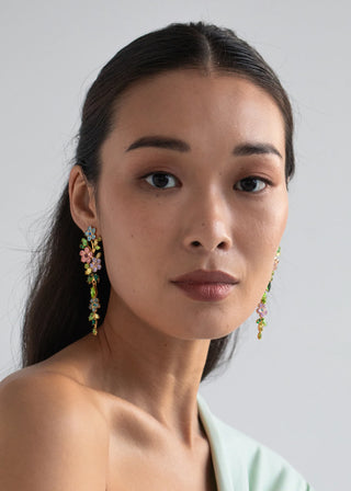 Statement earrings featuring cascading floral motif and hinged movement