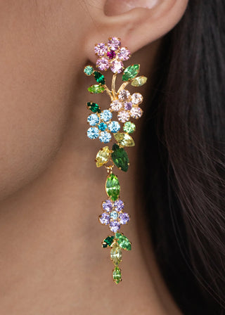 Face-framing designer earrings with articulated blooms and shimmering accents