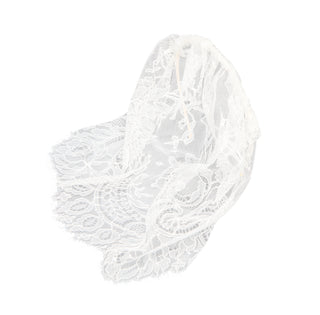 Handcrafted lace piece featuring fine floral details and a lightweight drape, perfect for elegant bridal and formal ensembles.