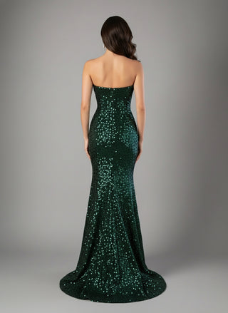 Woman wearing a strapless green sequin gown against a gray background