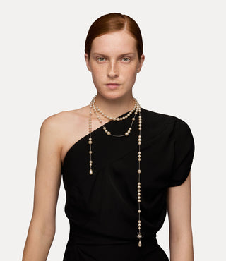 Female model, accessorized with the silver-tone Broken Pearl necklace for a sophisticated touch.