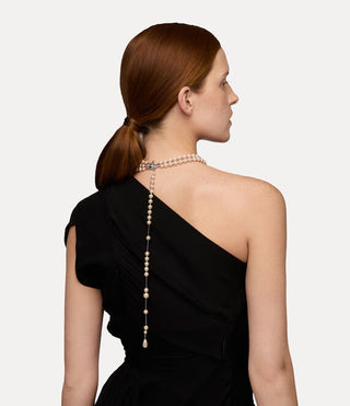 Back view of a female model wearing the silver-tone Broken Pearl necklace, highlighting its unique design.