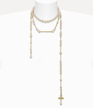 Gold-tone Broken Pearl necklace displayed on a mannequin, emphasizing its timeless elegance and design.