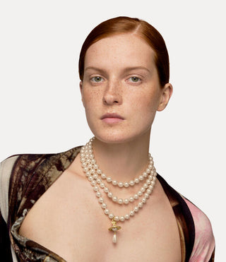 Vivienne Westwood handcrafted choker with iconic orb detail, exclusive couture design, and British design expertise.