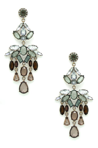 Pair of ornate earrings with gemstones on a white background