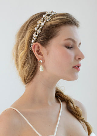 Model wearing the Manon Headband styled with elegant curls for a bridal look.