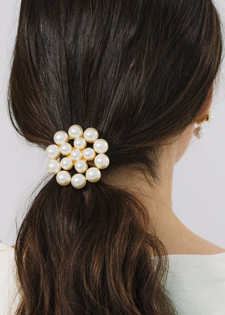 Handcrafted formal hair accessory with clustered pearl detailing and gold-plated structure for couture bridal styling