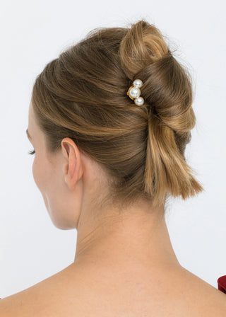 Model wearing the Gretel Hair Pin styled in a chic bun, demonstrating its elegant and versatile look.