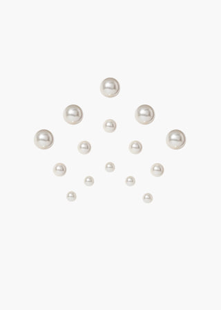 Set of pearls of various sizes on a white background