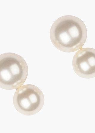 Close-up of Gretel Earring against a plain white background, showcasing its luminescent ivory crystal pearls and intricate craftsmanship.