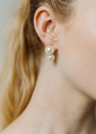 Side view of a model wearing the Gretel Earring, showcasing how it complements her hairstyle and enhances her overall look.