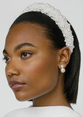 Model wearing the Iris Earrings, with a focus on her face, showcasing how the earrings complement her look.