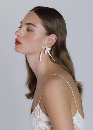 High-fashion earrings with sculpted movement, combining elegant drop form and signature Jennifer Behr details