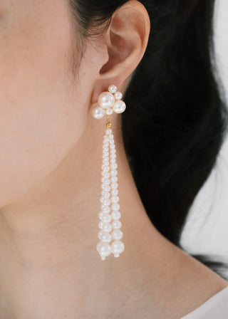 Designer earrings with artisanal pearl drops and clustered top, making a refined statement for high-end events and elevated evening moments.
