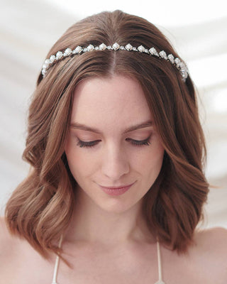 Woman wearing a decorative headband with a blurred background