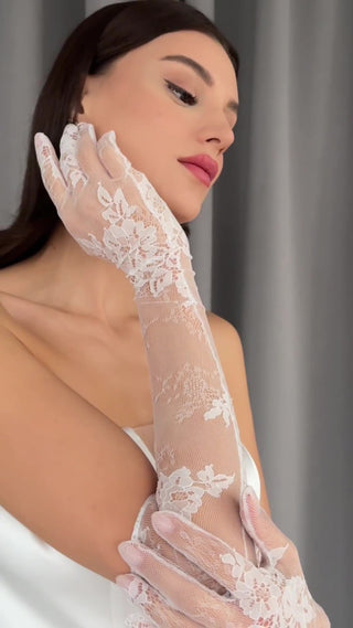 Elegant lace gloves featuring delicate pull-on fit and timeless floral detailing for formal bridal wear