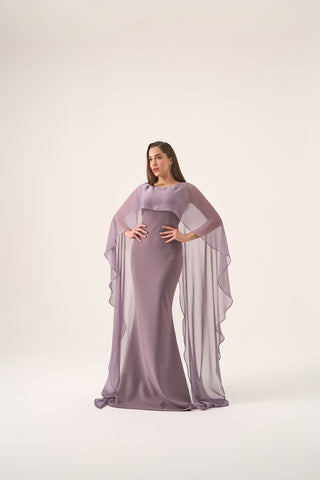 Sophisticated column gown with a sleek boat neckline and dramatic cape sleeves, designed for formal occasions