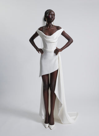 Vivienne Westwood bespoke bridal creation with dramatic sweeping train, couture cowl neckline, and luxury silk cady finish