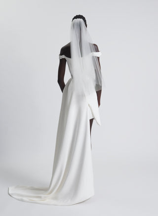Vivienne Westwood luxury wedding dress in ivory silk cady featuring bespoke asymmetric hemline and couture heritage draping