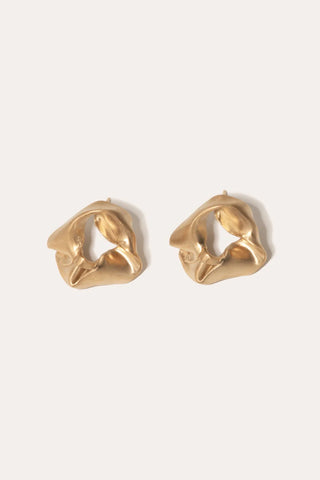 Sculptural earrings with fluid, draped design, crafted in recycled metal for a modern statement piece.