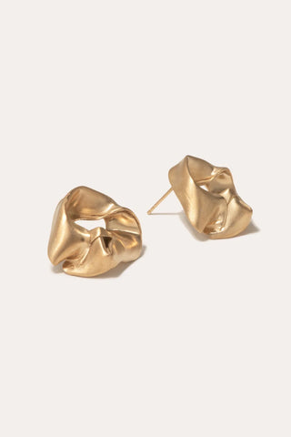 Designer earrings with a modern, sculpted silhouette, blending high-fashion artistry with sustainable materials.