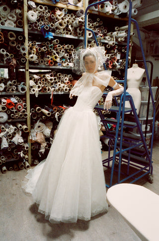 Vivienne Westwood made-to-order bridal gown in tulle and Chantilly lace featuring corseted bodice and romantic layered volume