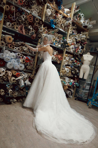 Vivienne Westwood made-to-order bridal design with structured dropped waist, voluminous silhouette, and artisanal detailing