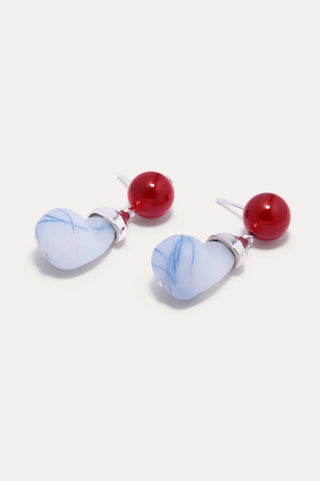 Sustainable designer earrings featuring a sleek, bold design with resin and agate set in silver.