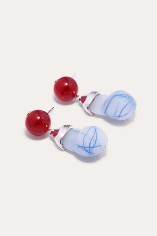 Elegant earrings with a contemporary, artistic form, showcasing bold agate and resin detailing.