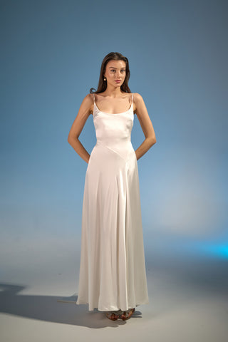 Sophisticated wedding dress with a fluid silk slip design, scoop neckline, and flattering contours