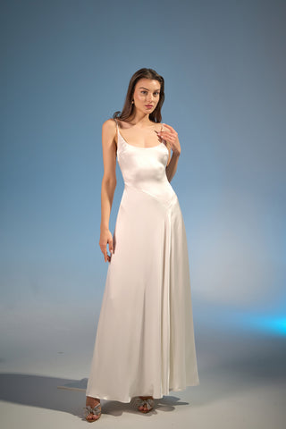 Graceful maxi gown with a scoop neckline, delicate straps, and bias-cut silk fabric perfect for luxury weddings